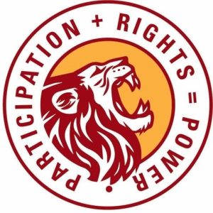 Our Voice SA logo. A circle with a lion in it. The words ‘participation plus rights equals power’ are written around it